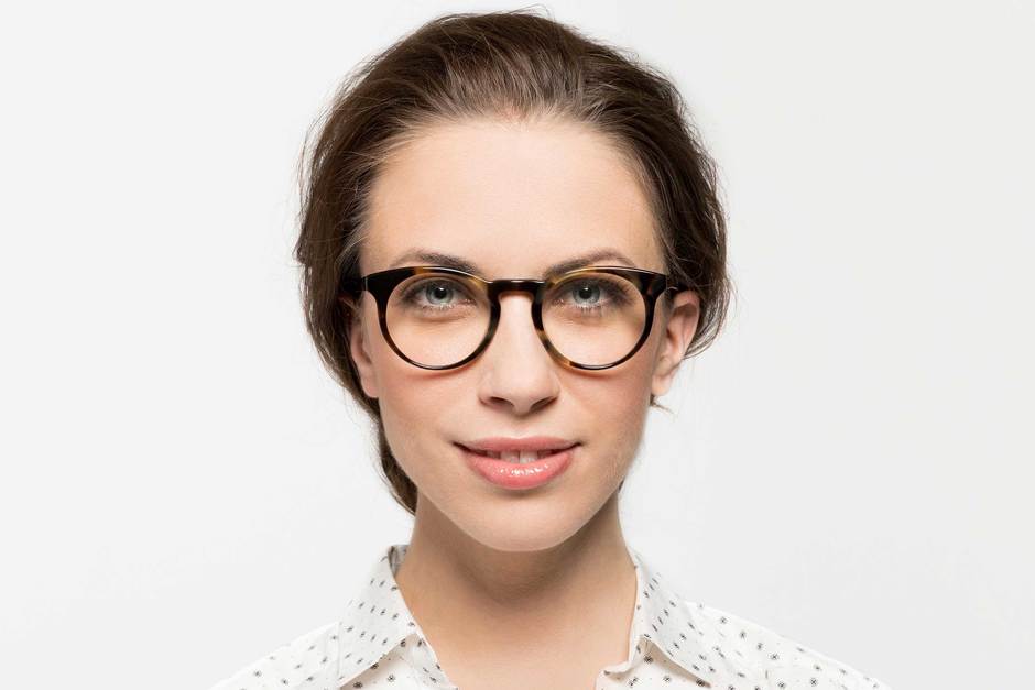 Turing eyeglasses in whiskey tortoise on female model viewed from front